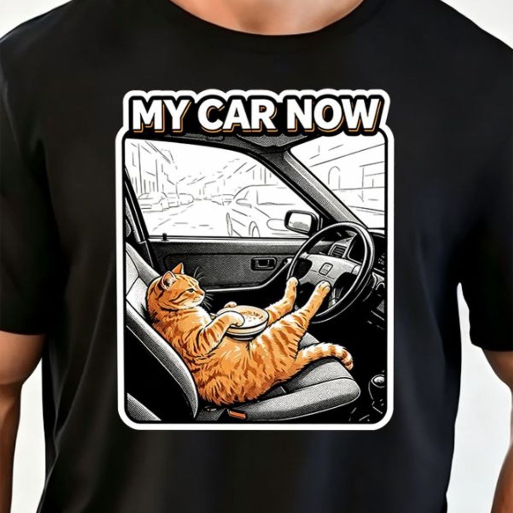 Cat Driving Food with Orange Black Design Graphic T‑Shirt, Automobile Interior, Playful Printed Tee